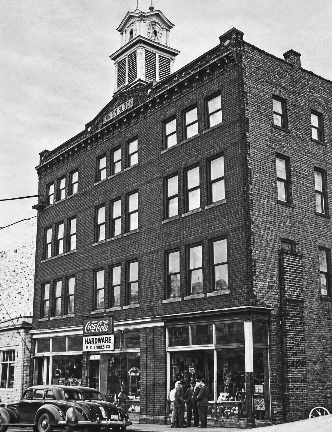 Historic photograph of the Orrison Building and its clock tower
